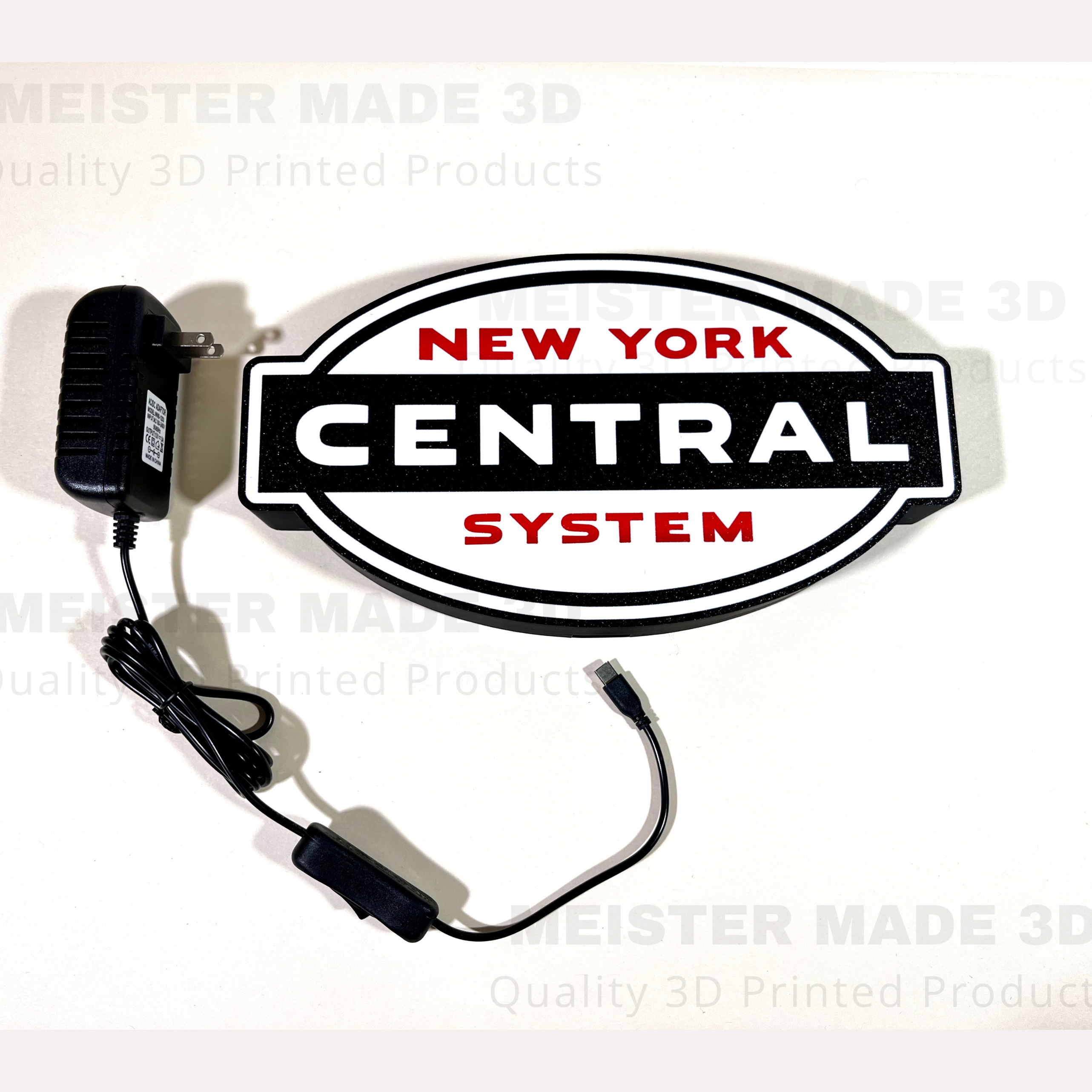 New York Central System logo with power adapter on a white background
