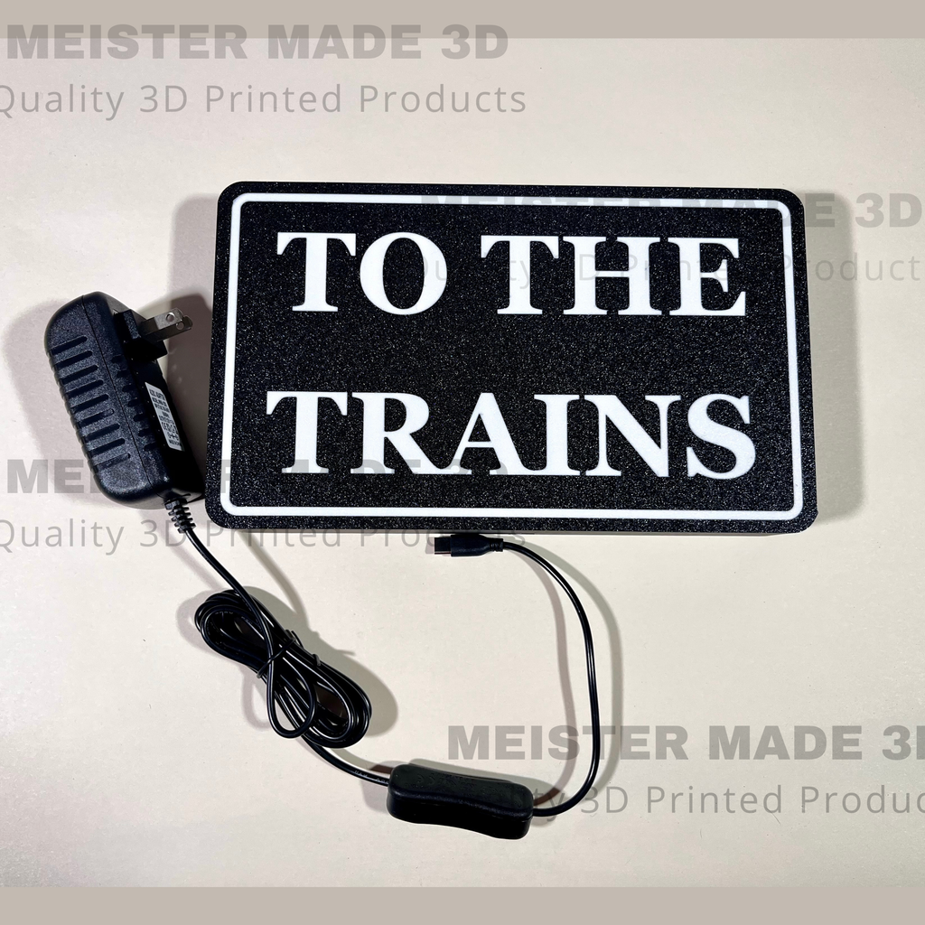 "To The Trains" LED illuminated sign for railroad enthusiasts