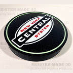 Round black sign with a light green outline and NYC New York Central System logo in the center.