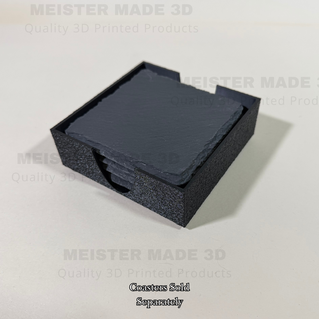 Angled view of a black 3D printed slate coaster holder with natural slate coasters inserted, designed to neatly organize 4 to 5 coasters on a tabletop.