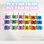Butterfly keychains in various colors with text 'Pick your color! Pick your design!' on a white background.