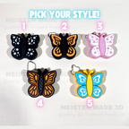 Butterfly-shaped keychains in various colors with 'Pick Your Style!' text above them.
