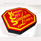 Red and yellow 'Kansas City Southern Lines' sign on a white background
