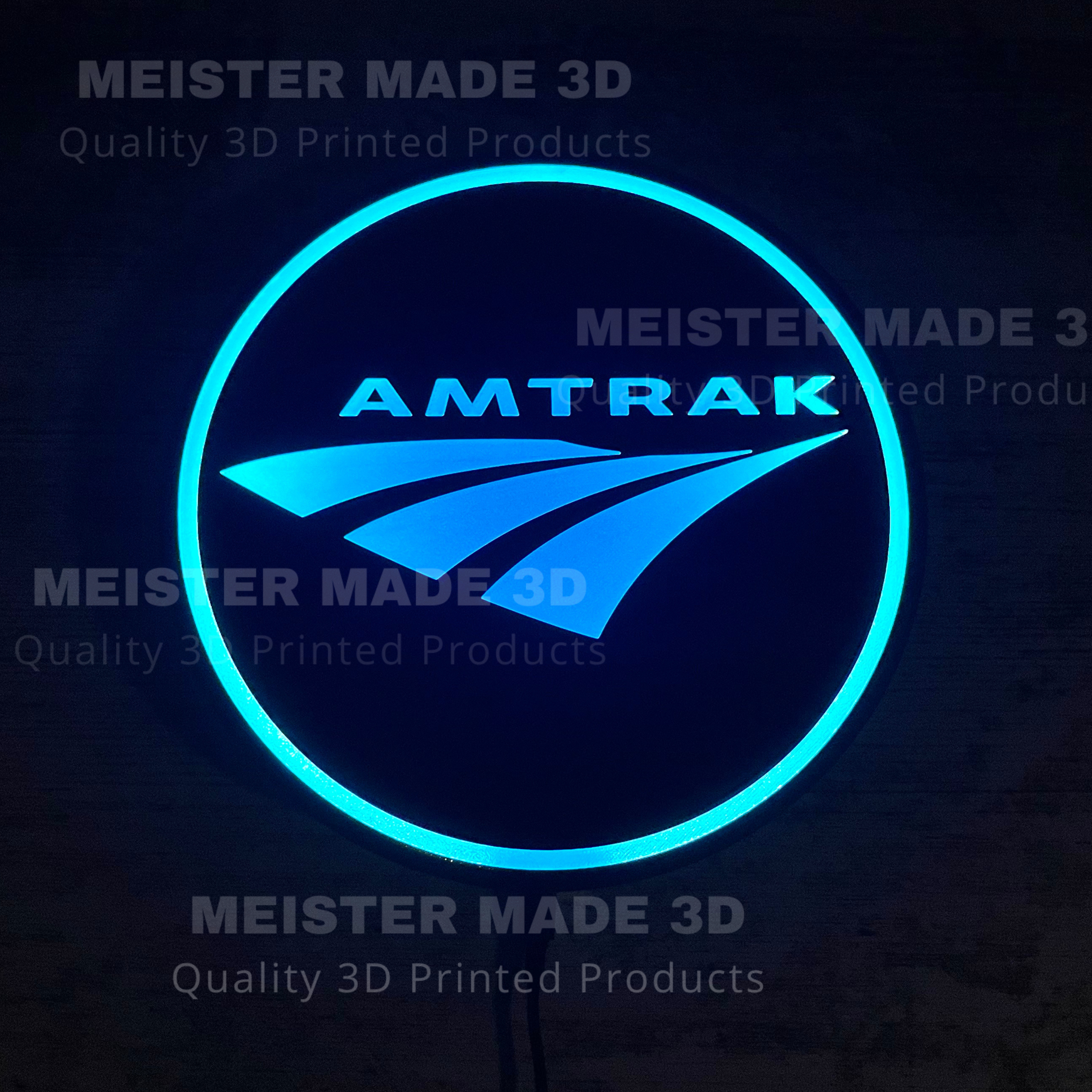 Amtrak logo with blue neon outline on a dark background, featuring 'Meister Made 3D' branding.