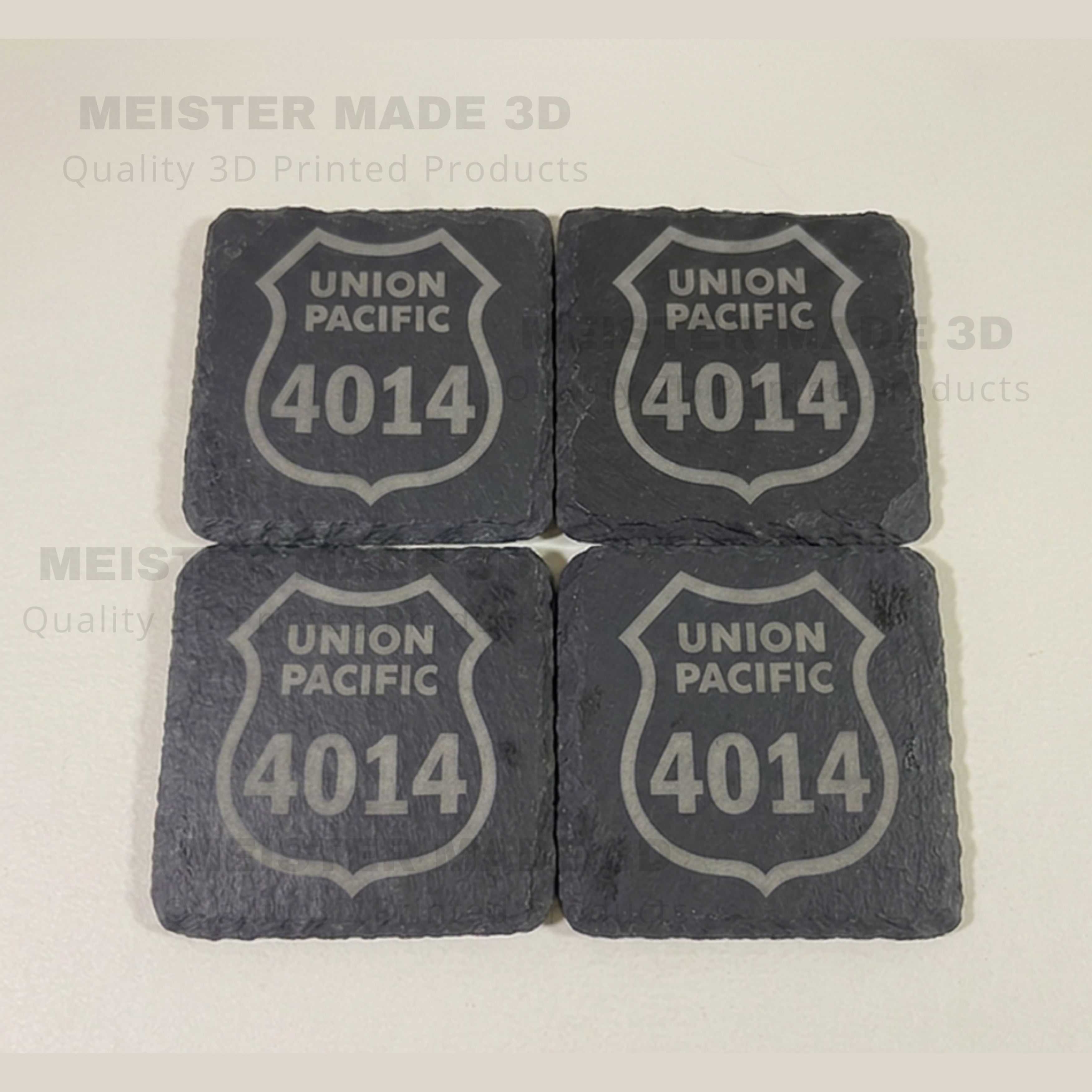 Four slate coasters with Union Pacific logo and number 4014 on a light background.