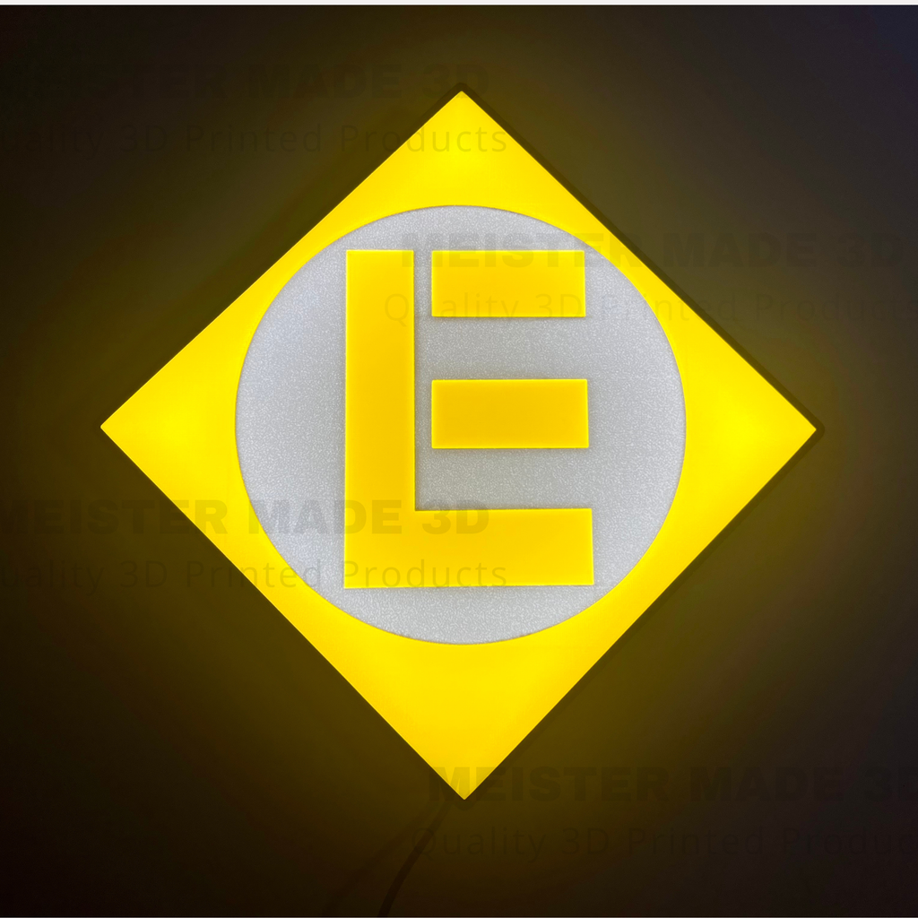 Illuminated sign. Yellow and gray logo with the letter 'E' on a dark background