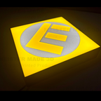 Yellow square with a large 'E' in the center on a dark background