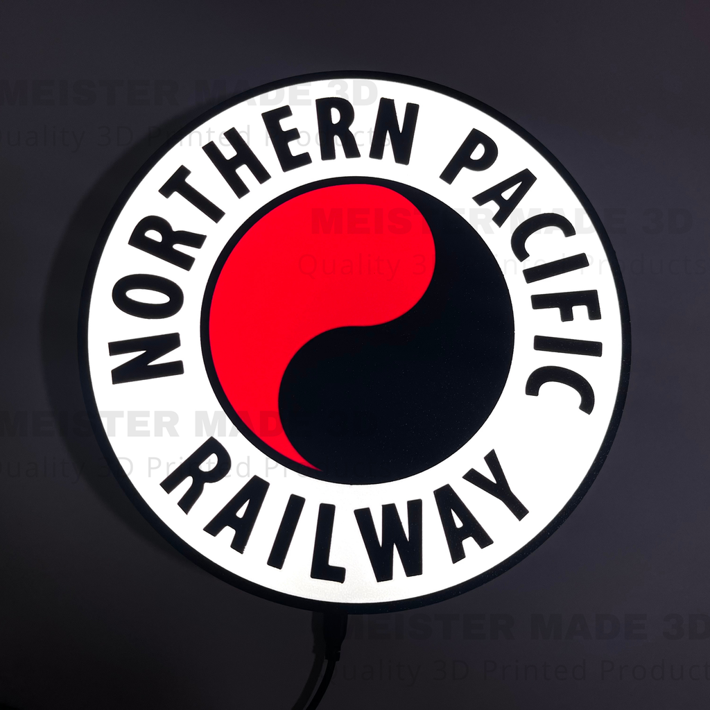 Illuminated Northern Pacific Railway logo with red and black design on a dark background