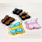 Colorful butterfly-shaped keychains on a light background with 'MEISTER MADE 3D' branding.