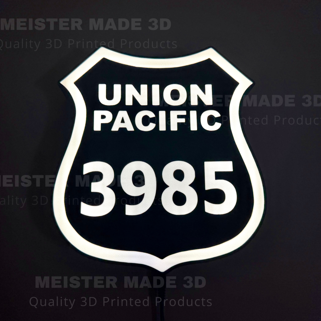3D printed led illuminated 3985 shield sign on a dark background showing the sign illuminated