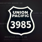 3D printed led illuminated 3985 shield sign on a dark background showing the sign illuminated