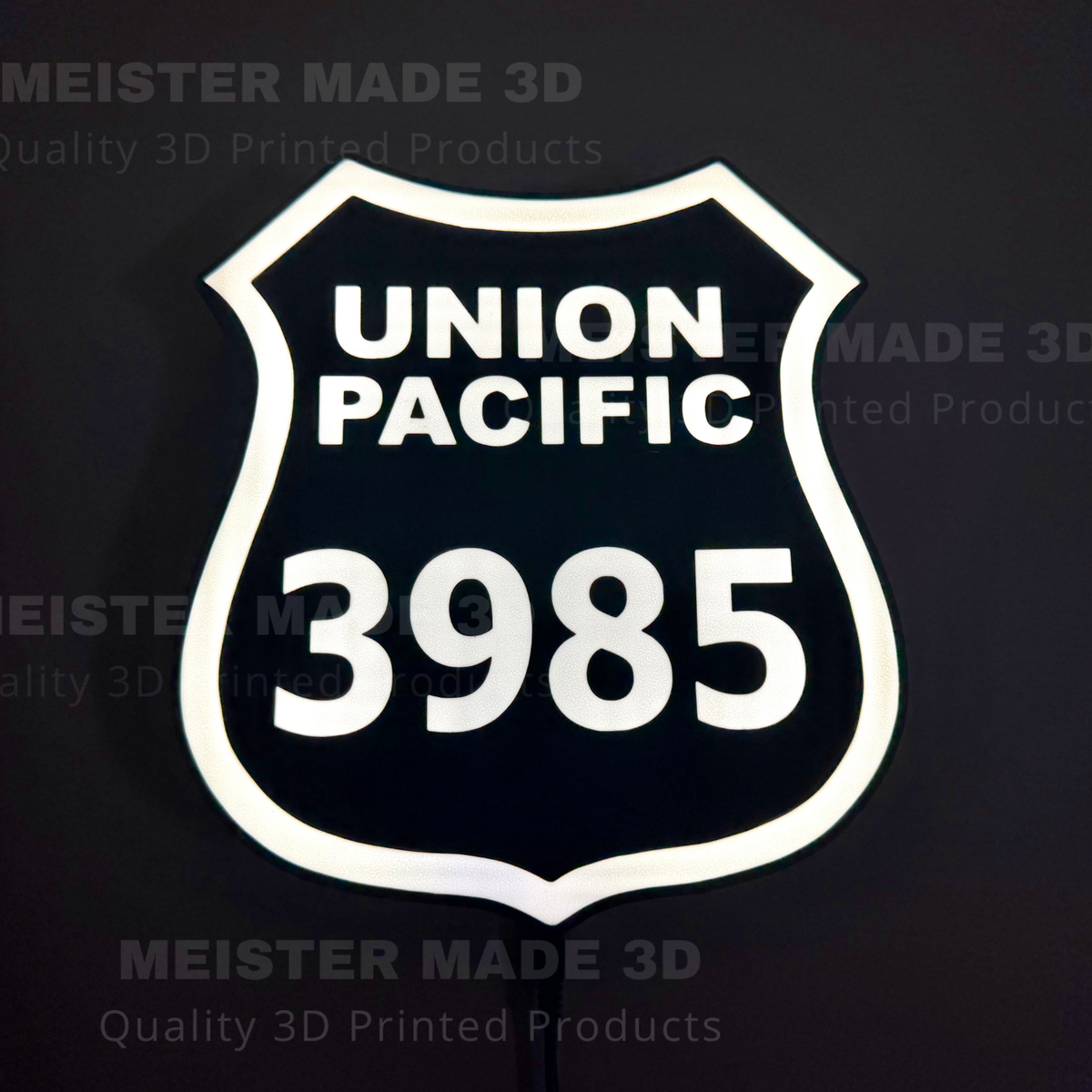 3D printed led illuminated 3985 shield sign on a dark background showing the sign illuminated