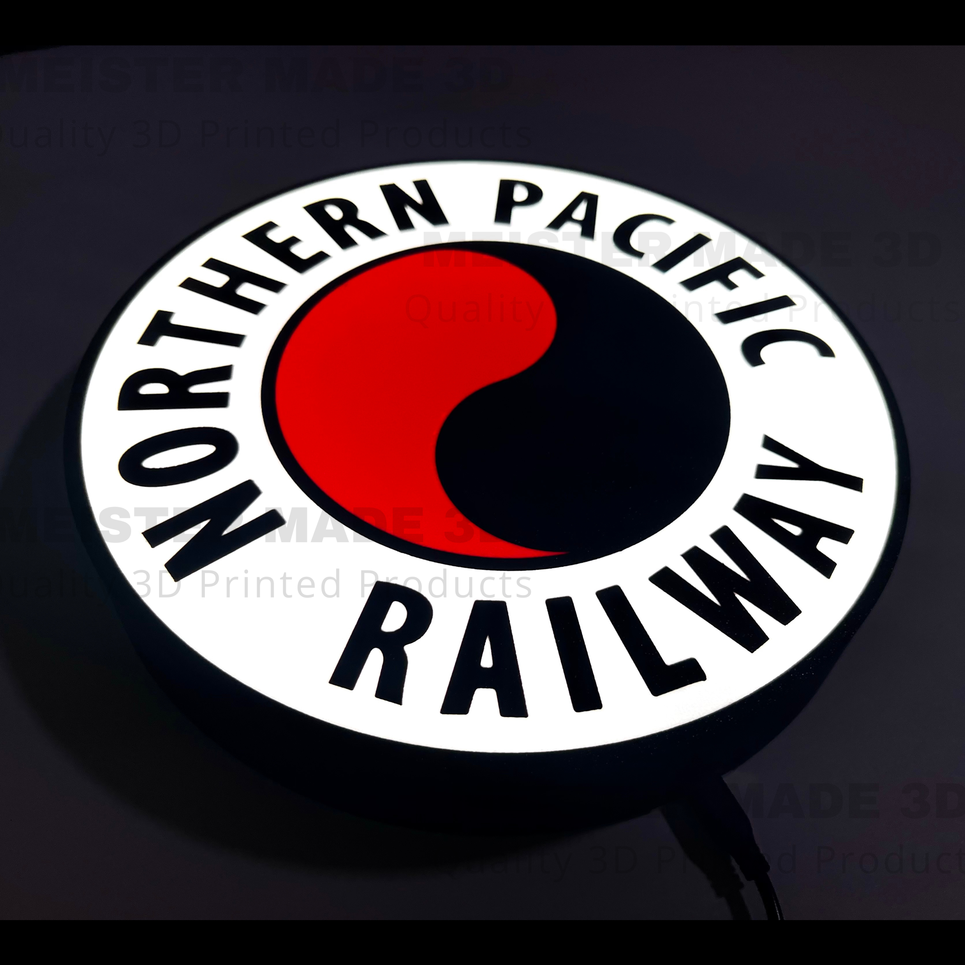 Illuminated Northern Pacific Railway logo with red and black design on a dark background