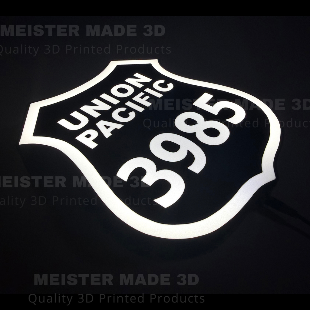 3D printed led illuminated 3985 shield sign on a dark background showing the sign illuminated