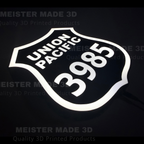 3D printed led illuminated 3985 shield sign on a dark background showing the sign illuminated