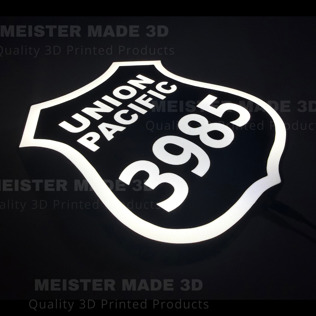 3D printed led illuminated 3985 shield sign on a dark background showing the sign illuminated