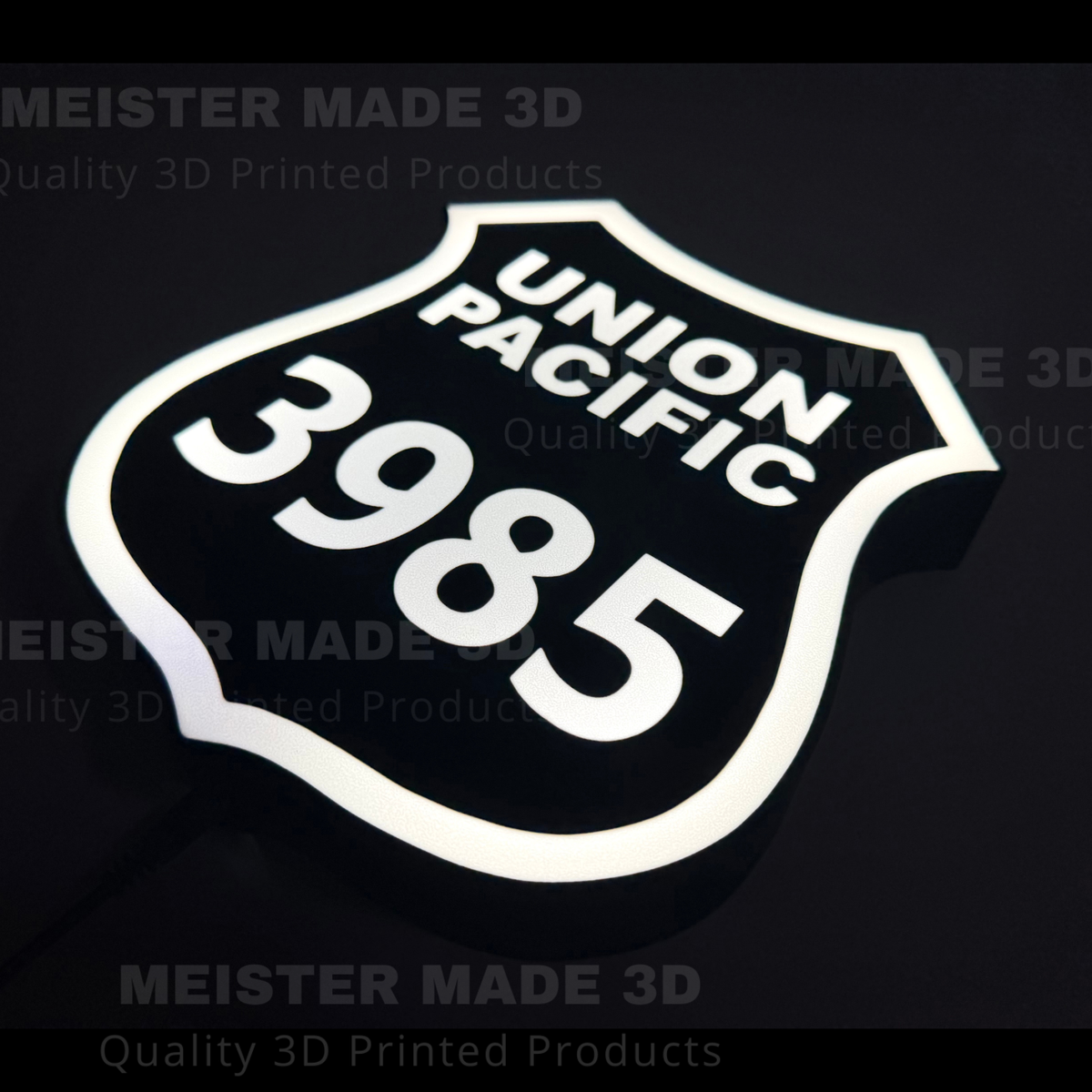 3D printed led illuminated 3985 shield sign on a dark background showing the sign illuminated