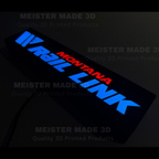 Illuminated Montana Rail Link LED sign glowing blue and red in a dark room, custom 3D printed railroad decor by MeisterMade3D.