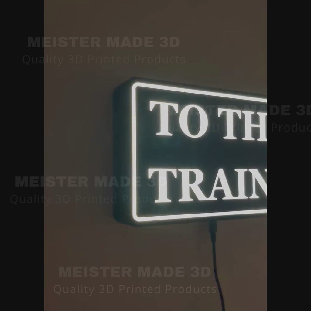 "To The Trains" LED illuminated sign for railroad enthusiasts